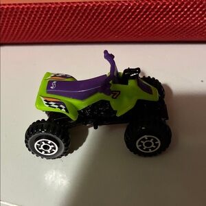 Vibrant Green and Purple Toy ATV